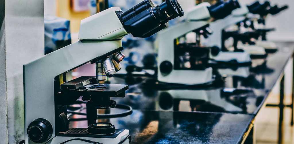 Microscopes on table.